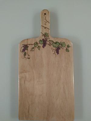 Custom made solid maple charcuterie board with woodburning details and coloring. Many more to choose from.