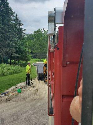 Paving a driveway from trucks point of view.