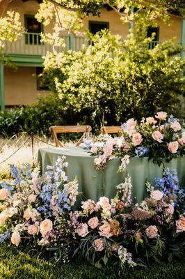 We were able to repurpose the chuppah and aisle flowers for the sweetheart table!