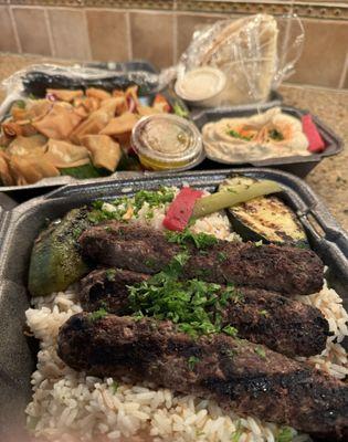 Shish kofta with rice, Fattoush salad, small hummus, + pita. Delicious!