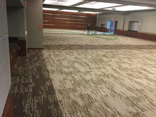 Drying out the carpet at a commercial water loss job.