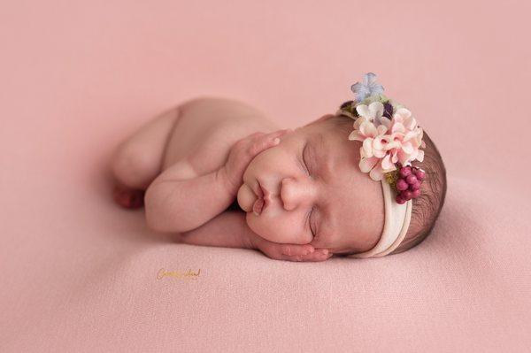 Newborn girl in studio.