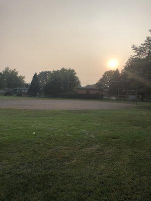 Baseball diamond. They have two and a grassy/soccer area between these dirt diamonds.