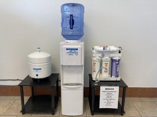 Top loading hot and cold water dispenser that is for sale plus under the sink alkaline reverse osmosis filtration system also for sale.