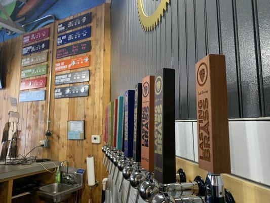 The paddles and flavor list on the wall.