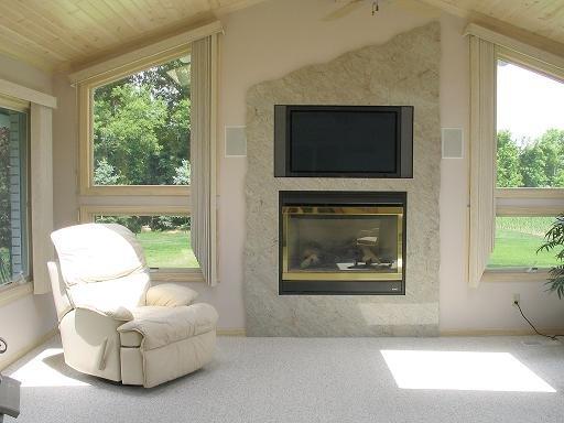 We work with your builder or architect every step of the way . .  TV install surrounded by granite.