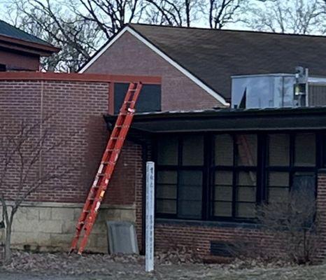 Unattended ladder at elementary school