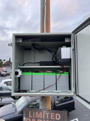 UPS battery back up for light pole used to supply network equipment in cameras