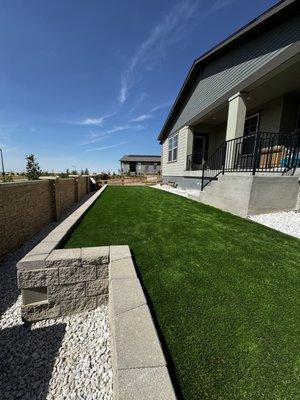 Grey wall with a nice artificial grass finish