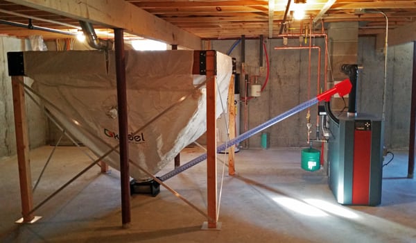 A new Kedel RTB wood pellet boiler and four ton hopper in a spacious basement in Portland.