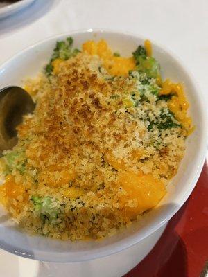 Broccoli gratin.  Has a little orange cheddar sprinkled on to, it's more of a creamy white cheese sauce inside.  Broccoli nicely cooked.