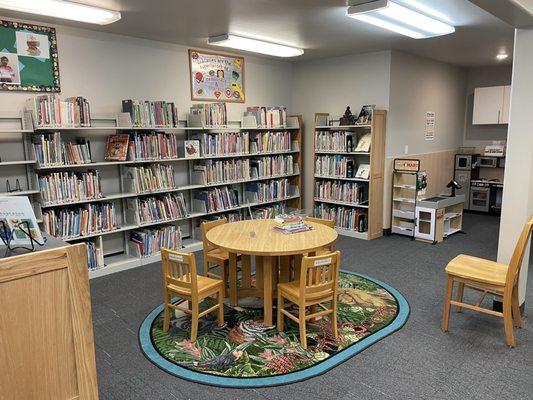 Space for kids to quietly play in the back of the kid's section. This area evolves, and always has nice clean toys/items to play with.