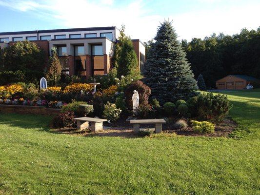 View of Notre Dame Retreat House as you are driving in from road .