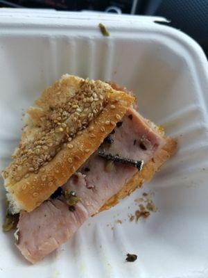 A muffuletta with a screw on it