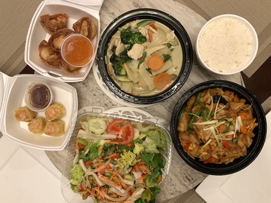 Clockwise: Green Curry with white rice, Drunken Noodles, Calamari Salad, Tulip Dumplings, Phu-ket Dumplings