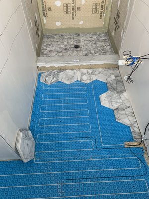 Heated floor with Marble tile.