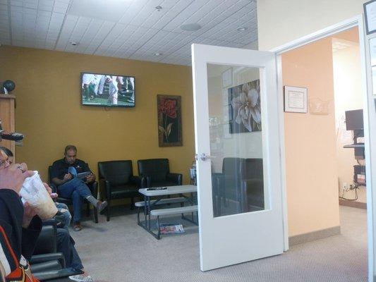 Waiting room with TV and childs table.