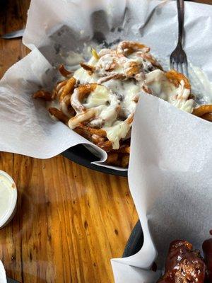 Hamburger/queso horseshoe with curly fries