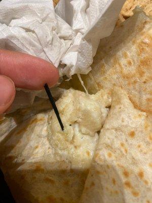 The piece of plastic in the shrimp quesadilla