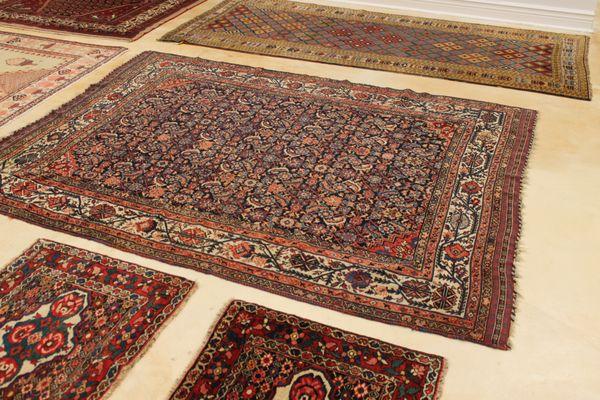 Display of late 19th century and early 20th century rugs