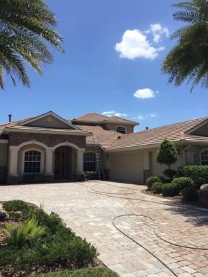 Beautiful home after roof , home and brick pavers were cleaned.