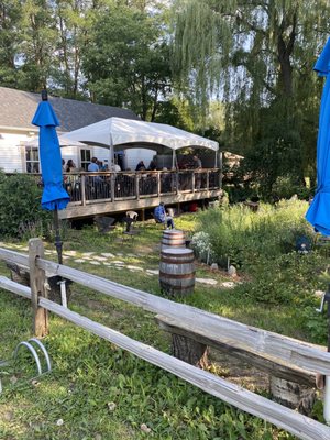 The outdoor deck area and the gardens seating area below.