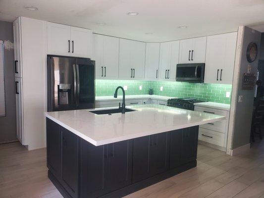 Two-tone shaker style kitchen and island