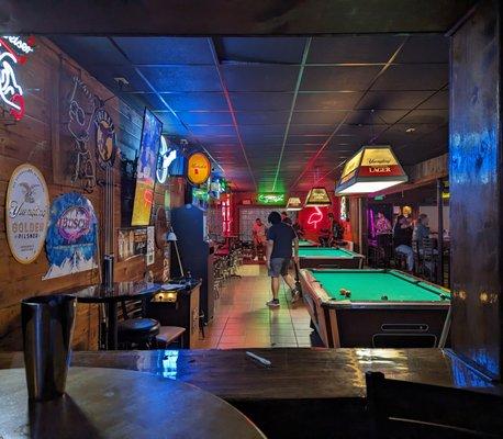 View from the backroom with the slot machines, 3 pool tables in the front