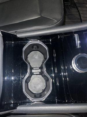 Cup holders somehow still wet. Hard to get picture of the smudges still present on the console.