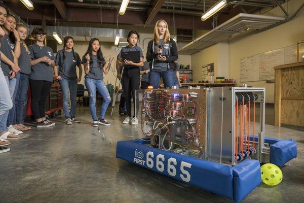 Our Robotics Team testing out their newly-built robot for upcoming competitions.