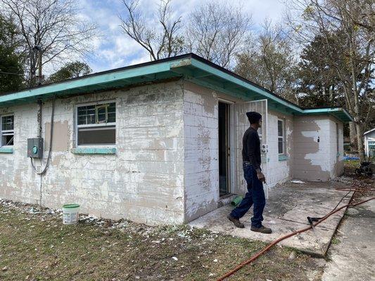 One of many rehabs properties exterior prep for paint (Before)