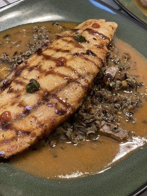 Fresh caught, pan seared black & red fish over a pork wild rice pilaf and brown gravy.