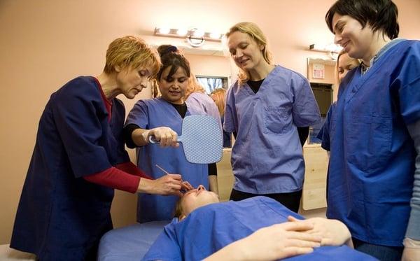 Students practicing eyebrow shaping