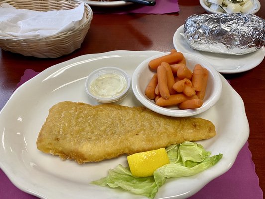 Beer battered cod with baked potato and carrots