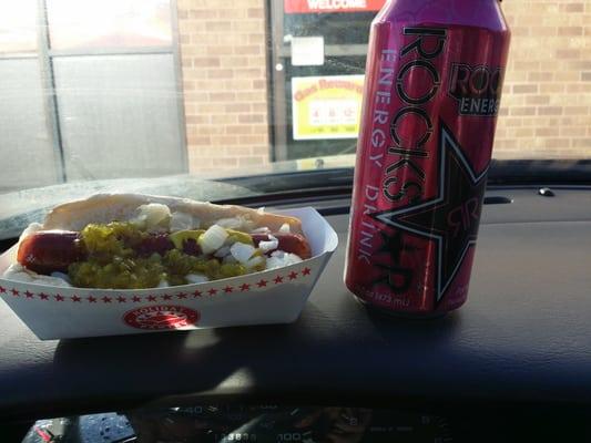 Jalapeño cheese dog with sourkraut, onions, relish, ketchup, & mustard with rock star energy drink called perfectberry.