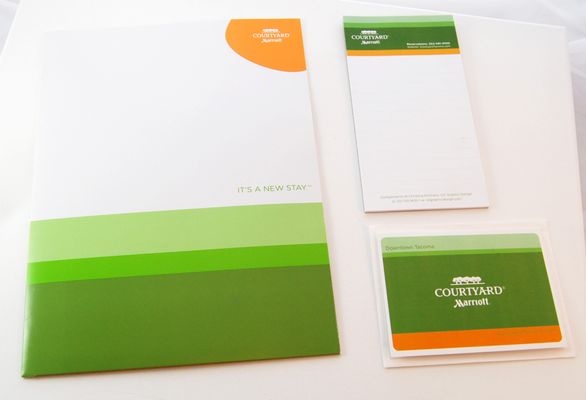 CY Branded materials; presentation folder, notepad and greeting card.