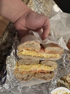 Whole wheat bagel with egg, cheese and tomato