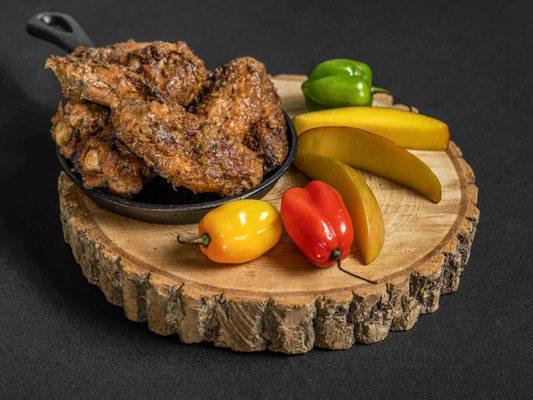 Jerk mango wings,
with coconut rice and plantains