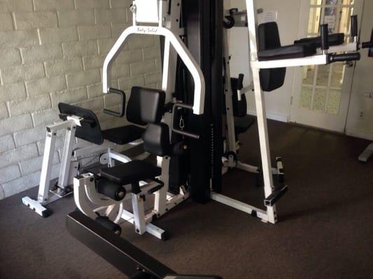 Fitness Center with multi station equipment, treadmill and spinner bicycle.