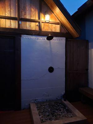 Rock-floored outdoor shower; works great as cold plunge