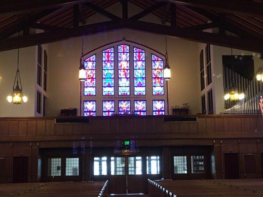 Choir loft showing organ and huge stained glass window !