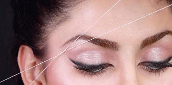 Perfect shape of eyebrow with threading