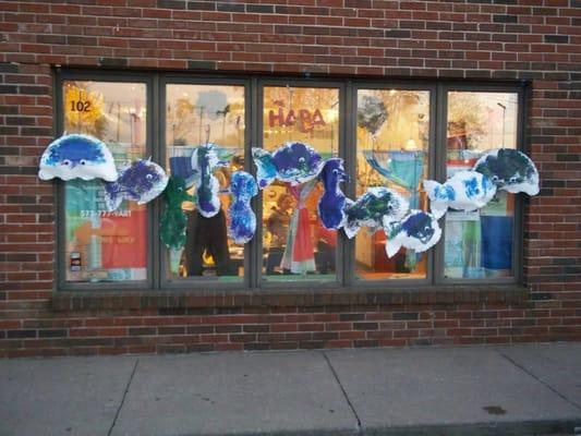 store front with drying ocean animals project