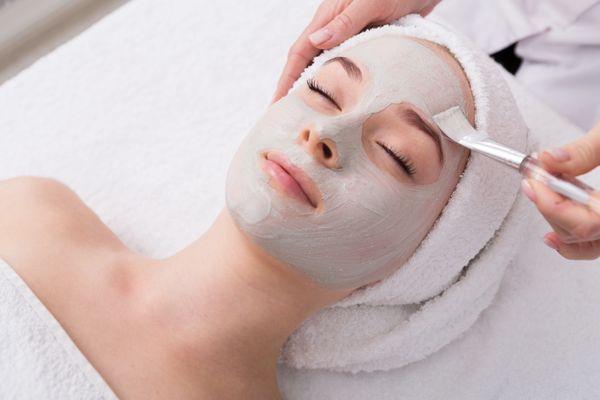 Relax and enjoy a custom facial with a mask.