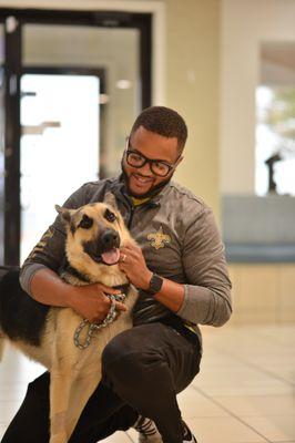 A happy patient and his owner after a visit at AMC