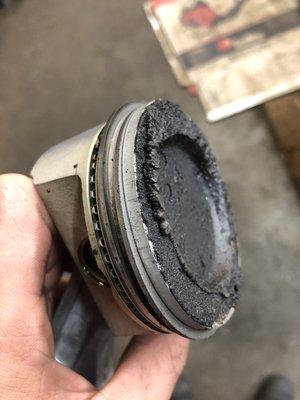 Carbon packed piston