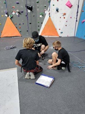 Learning about carabiner's with Coach Ryan.