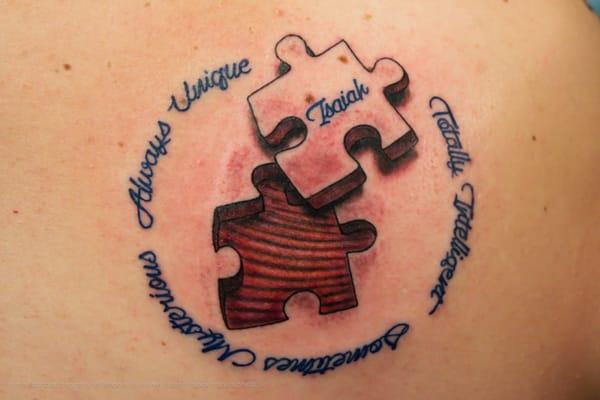 Puzzle piece tattoo by Jen.