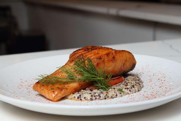 Grilled Salmon -
 Black quinoa, truffle oil, and tomatoes