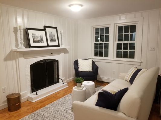 This room was originally all dark wood stained panels, all white now...